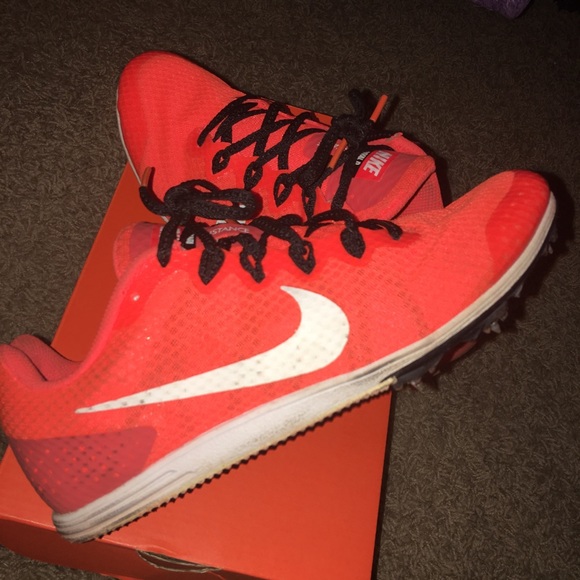 orange nike spikes